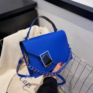 Elegant Structured Top‑Handle Bag with Statement Clasp